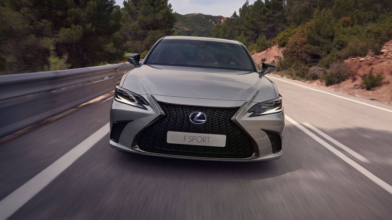 Lexus ES 300h driving in a rural area 