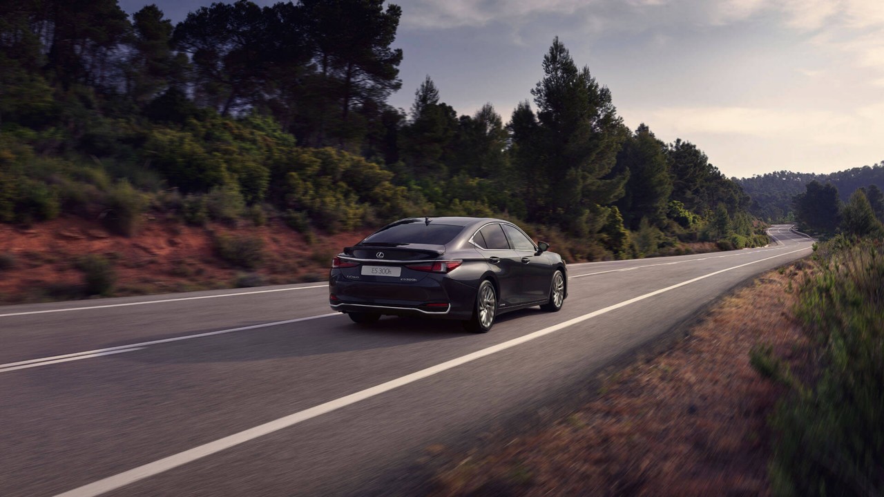 Lexus ES 300h driving in a rural area 