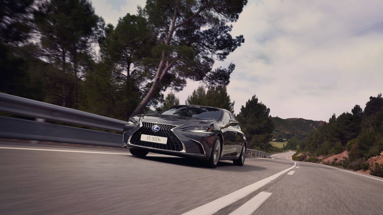 Lexus ES F Sport driving around a corner 