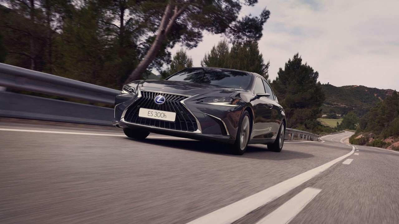 Lexus ES 300h driving in a rural area 