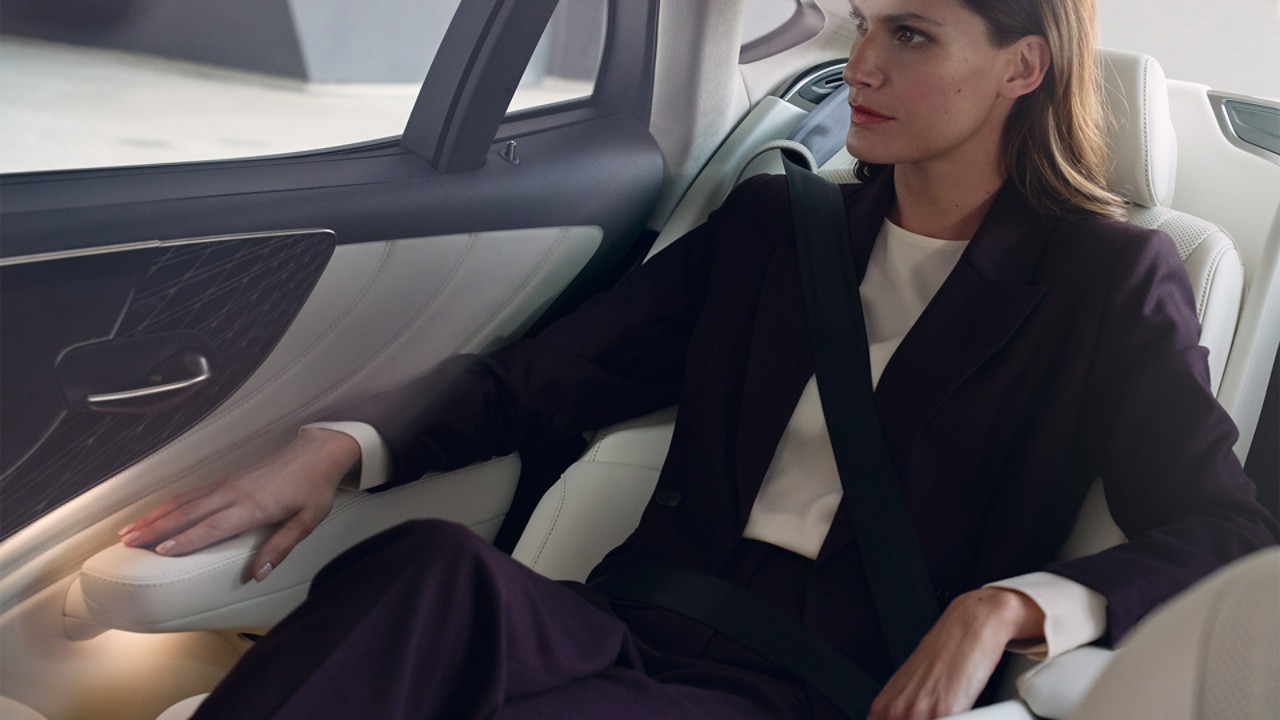 A woman sat in a Lexus LS